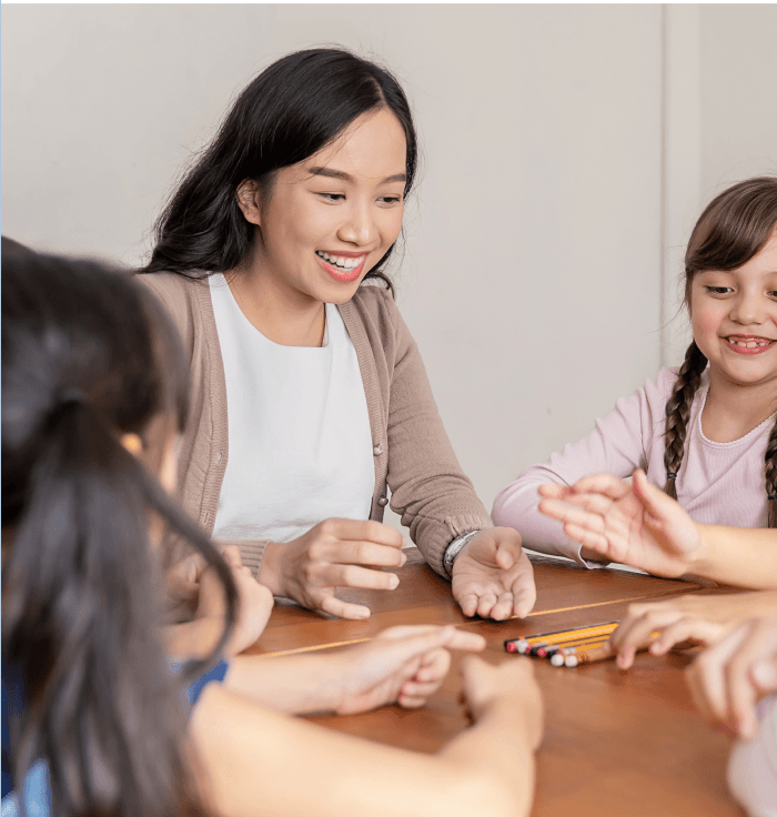 Teacher guiding children in class