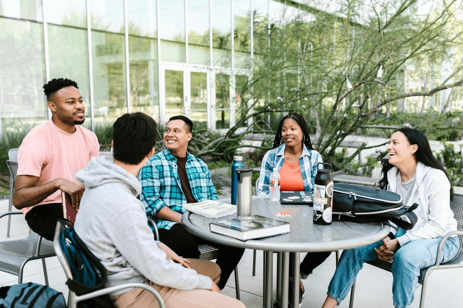 Adult students talking together outdoors