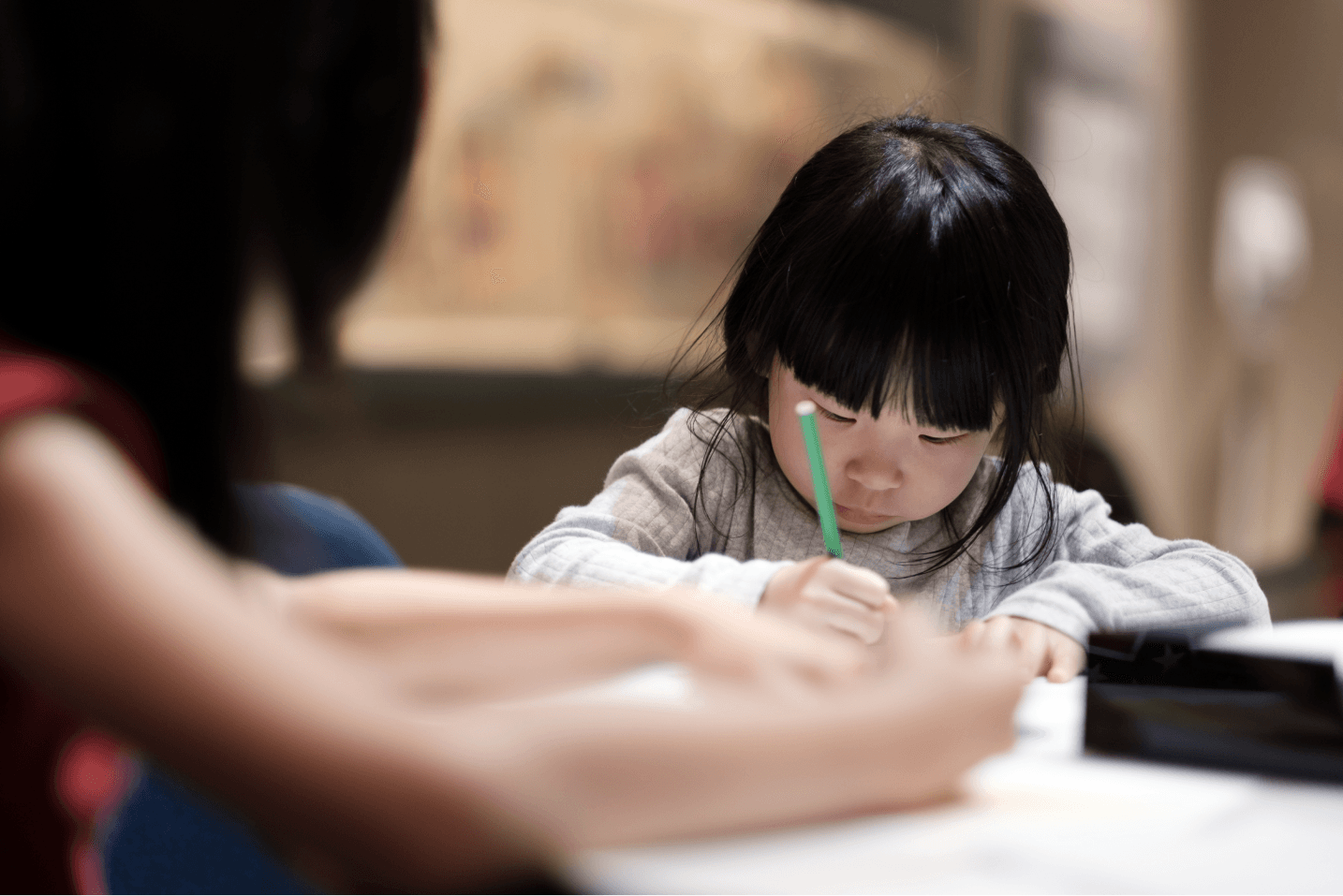 Child concentrating on a writing contest