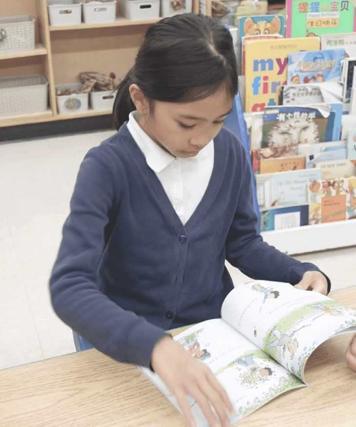 Student reading a Chinese book